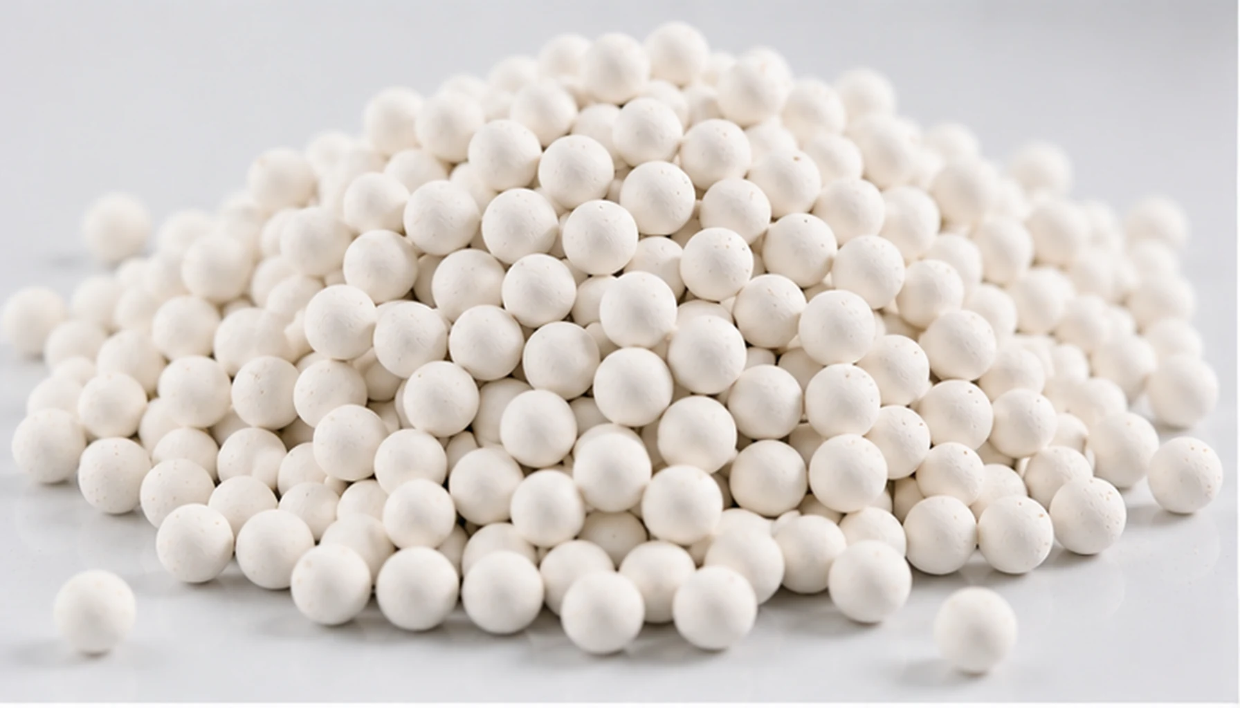 Activated alumina balls closeup for drying water treatment and adsorption media